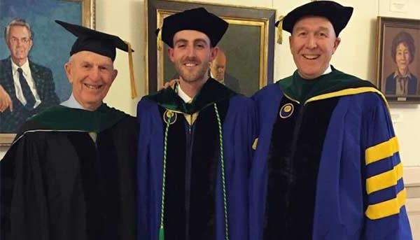 Kevin J. Geary ’83M (MD), ’88M (Res), ’90M (Flw) poses with his nephew, Michael Geary ’16M (MD), and his father, Joseph Geary, at Michael’s graduation from SMD dressed in graduation regalia